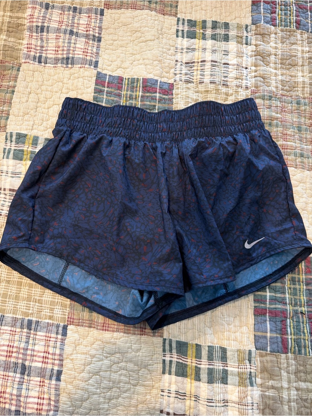 Nike Women's Dark Navy Athletic Running Shorts with Subtle Red Print
